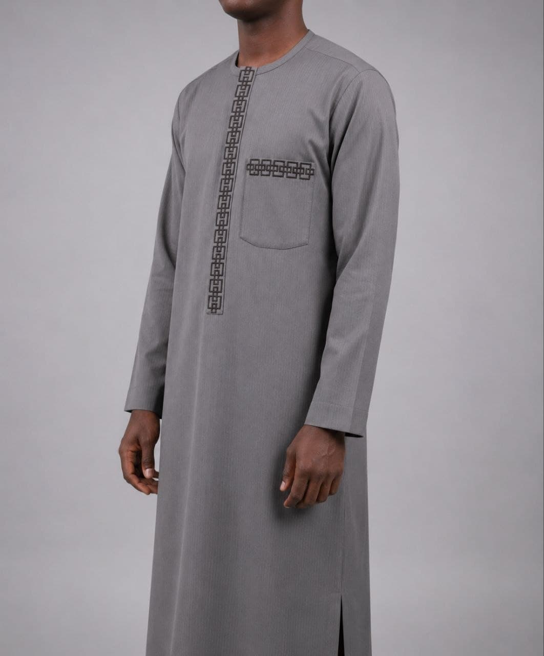 Grey kaftan photographed from the side on a stand